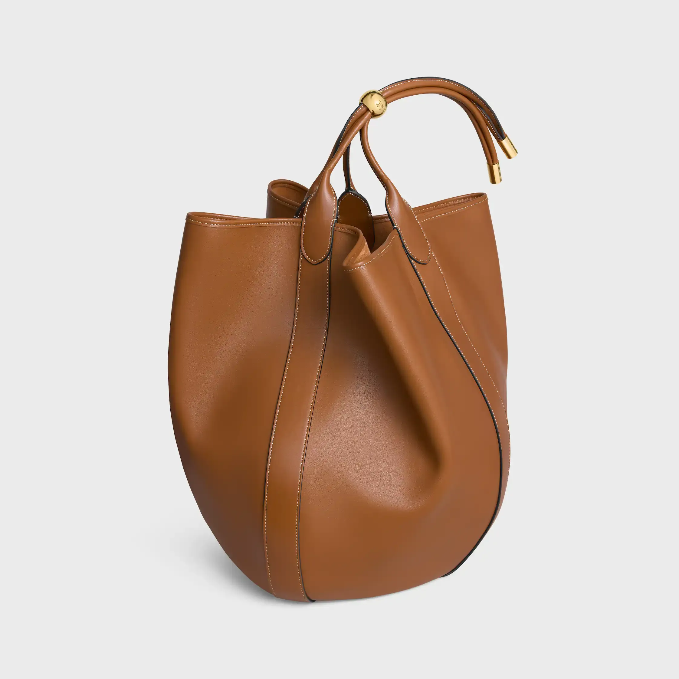 BOLSA BUCKET GRANDE EM COURO DE VACUO MACIO