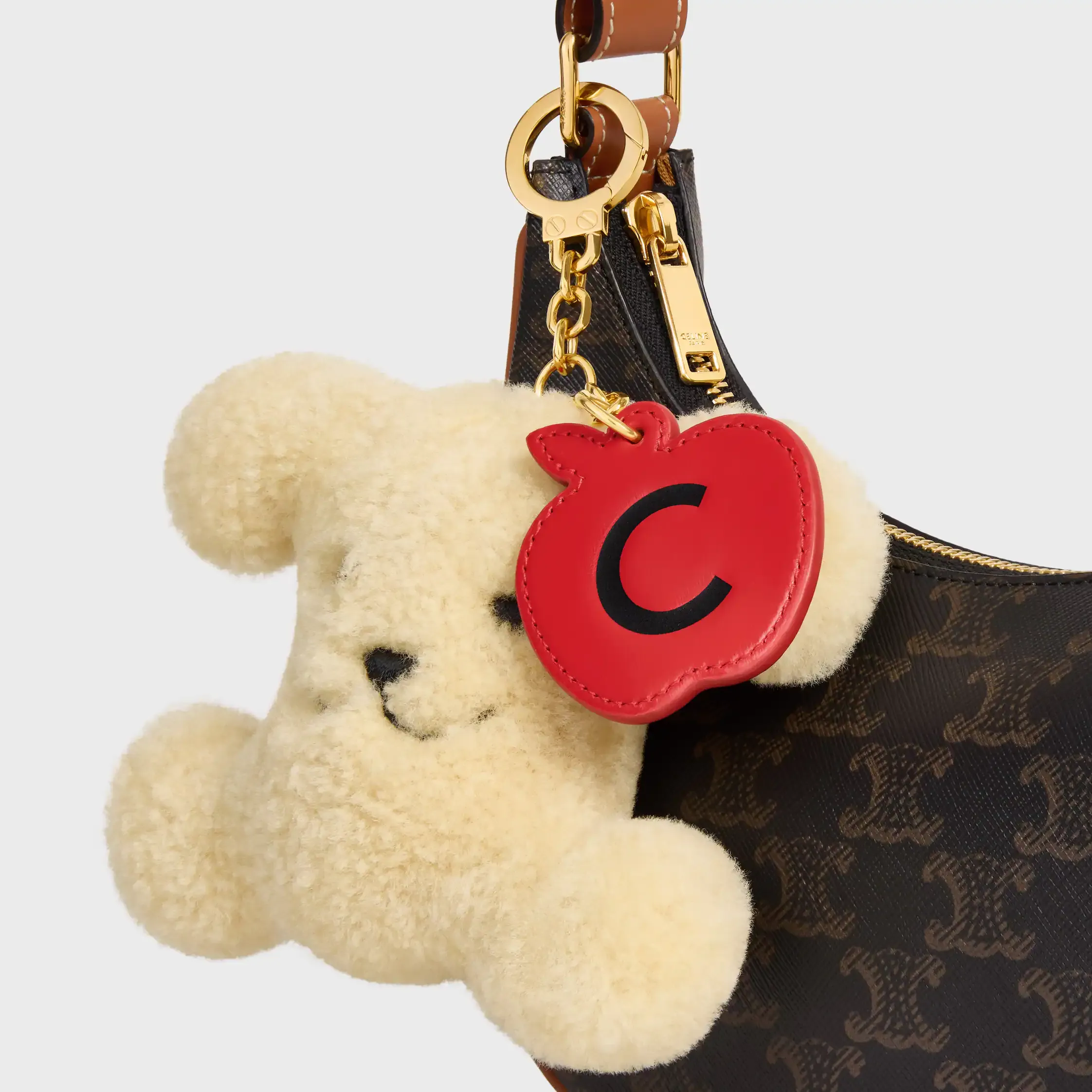 CHARM POM-POM TRIOMPHE MAÇÃ EM PELE DE OVELHA E COURO DE VACADO