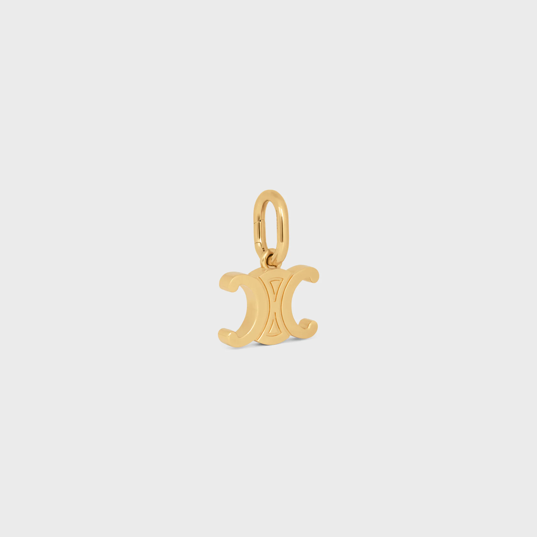 CHARM TRIOMPHE EM BRONZE COM ACABAMENTO DOURADO