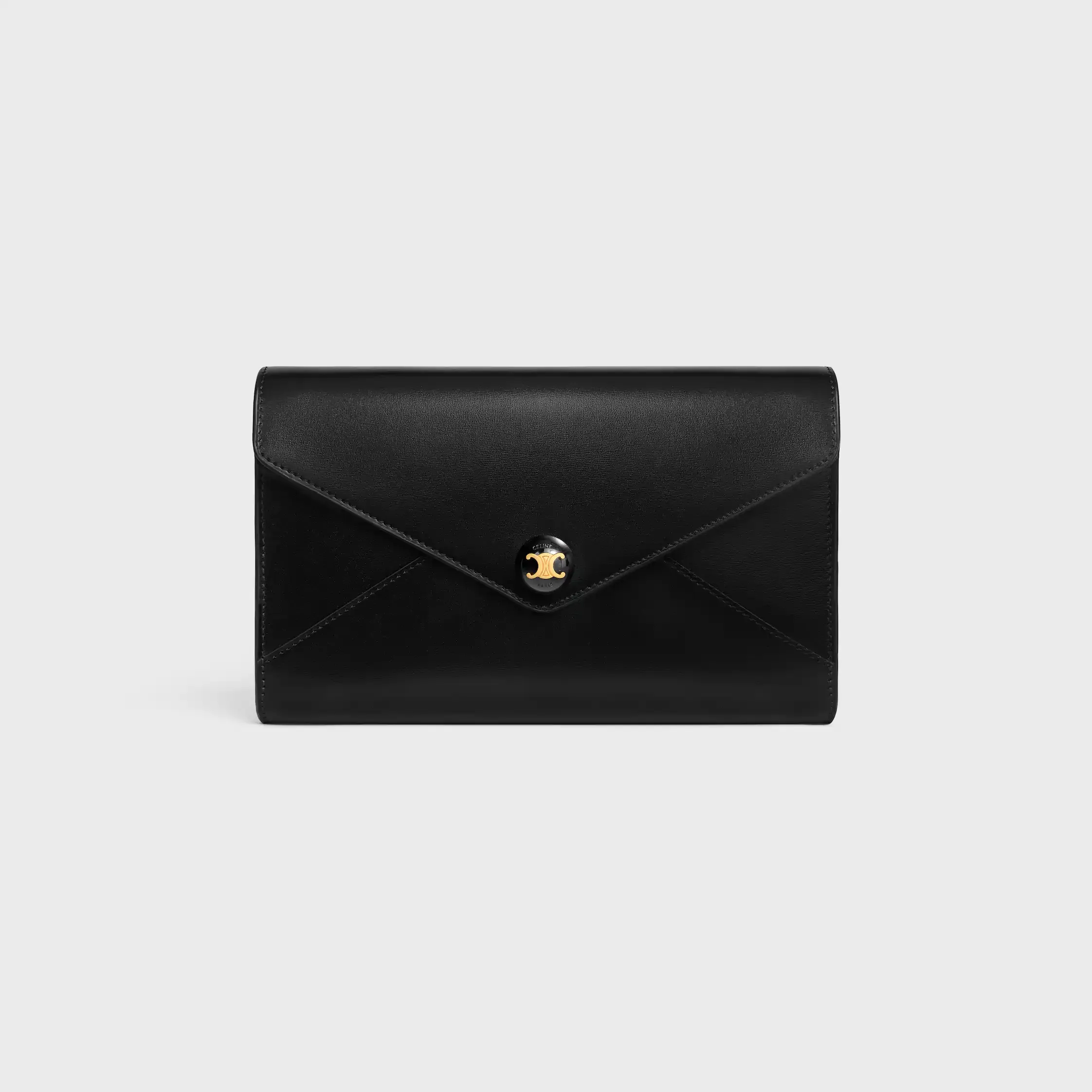 BOLSA-ENVELOPE COM CORREIA EM COURO DE VACA BRILHANTE