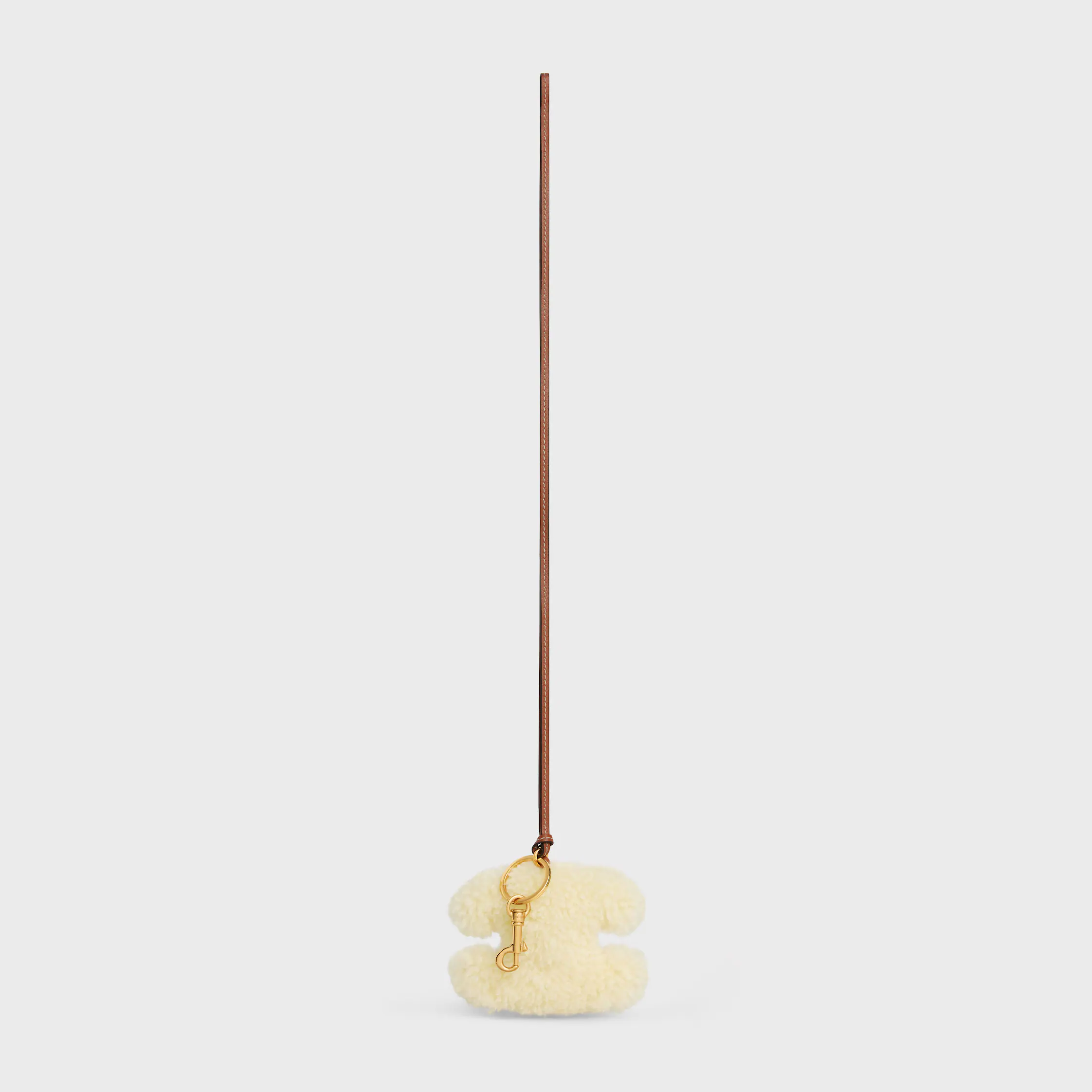 TRIOMPHE porta-chaves com pompom em PELE DE OVELHA E COURO DE VACADO LISOS com acabamento dourado