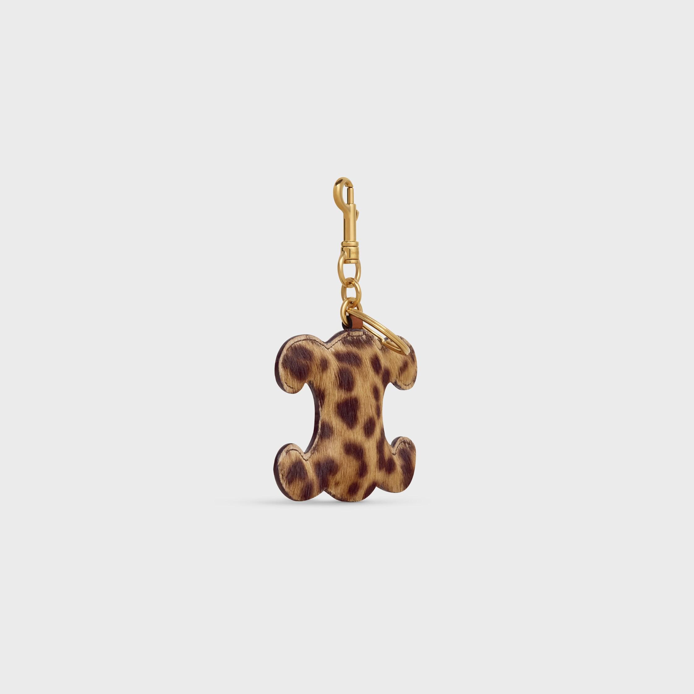 Chaveiro com pompom TRIOMPHE em PONY com estampa de leopardo e couro de bezerro