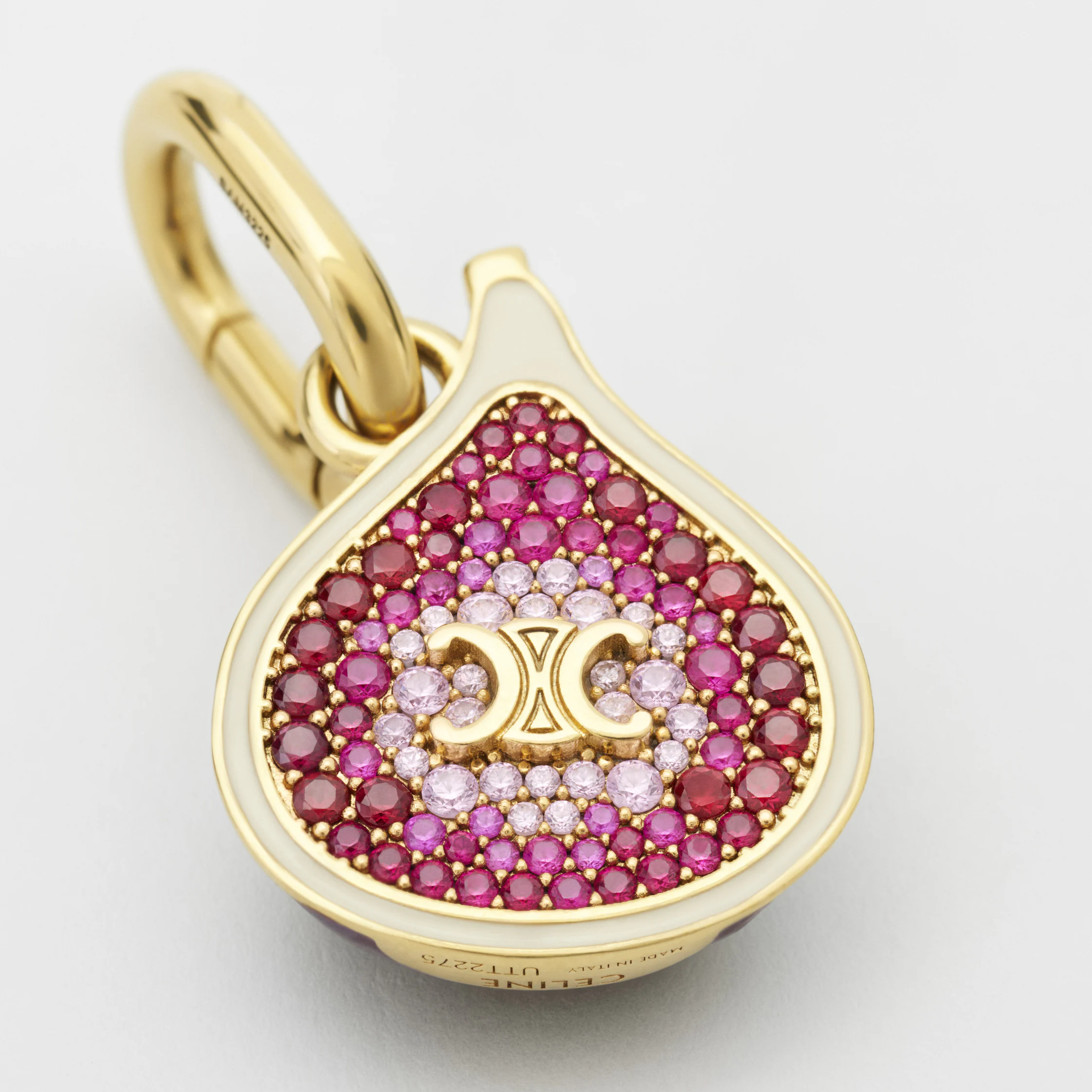 CHARM EM FORMA DE FIGURA EM BRONZE COM ACABAMENTO DOURADO, ESMALTE E STRASS